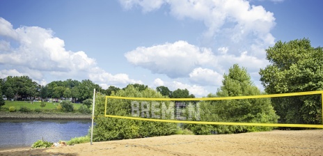 A volleyball net on a beach on the Weser river 