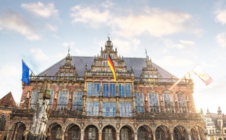 Bremen's town hall with three flags.