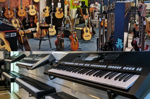 Mehrere Gitarren und Keyboards sind in einem Showroom ausgestellt. 